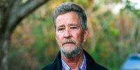 Leslie McCrae Dowless Jr. poses for a portrait outside of his home in Bladenboro, N.C., Dec. 5, 2018.