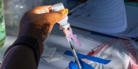 A nurse prepares a vaccination during a Covid vaccination clinic at Villa Parke in Pasadena, Calif., on July 8, 2022.
