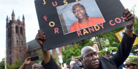 Civil rights attorney Benjamin Crump takes part in a march for Justice for Richard "Randy" Cox in New Haven, Conn., on July 8, 2022.
