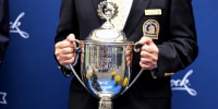 The Champions Trophy is held at the finish line during the 125th Boston Marathon on Oct. 11, 2021.