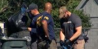 Members of the FBI assist the Chatham County Police Department in the search for toddler Quinton Simon in Georgia, on Monday.