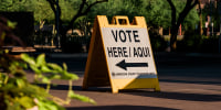 A "Vote Here" sign in Phoenix, Ariz., on Aug. 2, 2022.