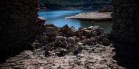 Cracks in the Sau reservoir in Catalonia, Spain, on Oct. 3, 2022.