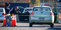 Investigators document the vehicle owned by the shooter outside a Walmart Supercenter where six people, including the shooter, were shot and killed on Nov. 23, 2022 in Chesapeake, Va.
