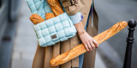 German model Alexandra Lapp holds a baguette during Paris Fashion Week on Feb. 25, 2020.