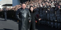 An undated photo released by the official North Korean Central News Agency (KCNA) on 27 November 2022 shows North Korean leader Kim Jong-un (C-L) walking with his daughter, presumed to be his second child, Ju-ae (C-R), during a photo session with the contributors to the successful test-fire of new-type ICBM Hwasongpho-17 at an undisclosed location in North Korea.
Successful test launch of Hwasongpho-17, Pyongyang, North Korea - 27 Nov 2022