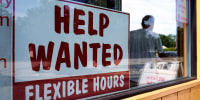 Help wanted sign is displayed in Deerfield, Ill., on Sept. 21, 2022. 