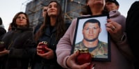 Family members of soldiers attend a memorial event in Kyiv