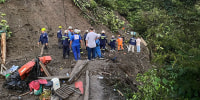 Rescue teams organize the search at the scene of landslide in Colombia