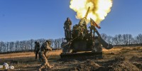Ukrainian servicemembers conduct a fire mission using two 2S7 "Pion" artillery systems in the Donetsk Region of Ukraine.