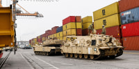 M1A2 Abrams battle tanks of the US army that will be used for military exercises by the 2nd Armored Brigade Combat Team, is unloaded at the Baltic Container Terminal in Gdynia on December 3, 2022. 