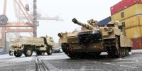 A M1A2 Abrams battle tank of the US army is unloaded at the Baltic Container Terminal