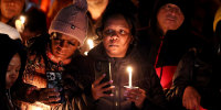 People attend a candlelight vigil in memory of Tyre Nichols at the Tobey Skate Park on January 26 in Memphis, Tenn.