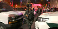Israeli security forces deploy at the site of a reported attack in a settler neighborhood of Israeli-annexed east Jerusalem