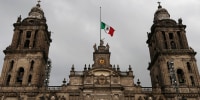 The Mexican national flag flies at half-mast on top of the Metropolitan Cathedral of Mexico City, Sept. 9, 2017.