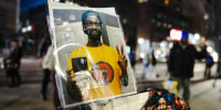 A photograph of Tyre Nichols is displayed during a rally against the fatal police assault of Tyre Nichols.