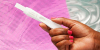 Young Woman Holding Pregnancy Test