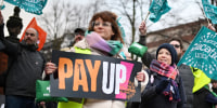 Children missed school and commuters faced severe disruption in the UK as half a million workers staged walkouts calling for higher wages in the largest such strikes in over a decade. 