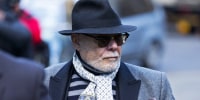 Gary Glitter arrives at Southwark Crown Court in London