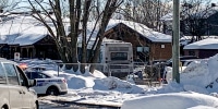 Image: Police secure the scene where a city bus crashed into a day care center on Feb. 8, 2023 in Laval, Canada.