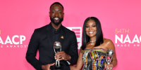Honorees Dwyane Wade and Gabrielle Union, recipients of the President's Award, pose in the press room during the 54th NAACP Image Awards at Pasadena Civic Auditorium on February 25, 2023 in Pasadena, California.