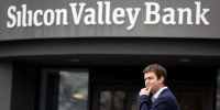 A customer stands outside of a shuttered Silicon Valley Bank (SVB) headquarters on March 10, 2023 in Santa Clara, California. Silicon Valley Bank was shut down on Friday morning by California regulators and was put in control of the U.S. Federal Deposit Insurance Corporation. Prior to being shut down by regulators, shares of SVB were halted Friday morning after falling more than 60% in premarket trading following a 60% declined on Thursday when the bank sold off a portfolio of US Treasuries and $1.75 billion in shares to cover  declining customer deposits. 