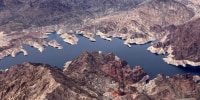A bathtub ring of light minerals show the high water mark on the shore of Lake Mead along the border of Nevada and Arizona on March 6, 2023, near Boulder City, Nev.