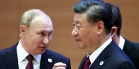 FILE - Russian President Vladimir Putin, left, gestures while speaking to Chinese President Xi Jinping during the Shanghai Cooperation Organization (SCO) summit in Samarkand, Uzbekistan, Sept. 16, 2022. China said Friday, March 17, 2023, President Xi will visit Russia from Monday, March 20, to Wednesday, March 22, 2023, in an apparent show of support for Russian President Putin amid sharpening east-west tensions over the conflict in Ukraine. (Sergei Bobylev, Sputnik, Kremlin Pool Photo via AP, File)