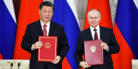 Russian President Vladimir Putin and Chinese President Xi Jinping attend a signing ceremony following their talks at the Kremlin in Moscow on March 21, 2023.