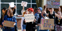Bettendorf High School students walk out in support of Iowa's LGBTQ+ students in response to pending legislation on March 1, 2023, in Bettendorf, Iowa.