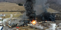 Portions of a Norfolk Southern freight train burns after a derailment in East Palestine, Ohio