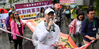 People hold the first authorised protest and march in several years in Hong Kong against the proposal for reclamation in the district on Tseung Kwan O on March 26, 2023.