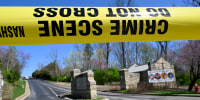 A police crime scene tape is seen at the entrance to Covenant School in Nashville, Tenn. Monday, March 27, 2023. Officials say several children were killed in a shooting at the private Christian grade school in Nashville. The suspect is dead after a confrontation with police. (AP Photo/John Amis)