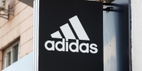 Adidas logo seen over the entrance to Adidas brand store in
