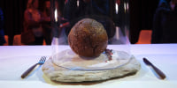 An Australian company has lifted the glass cloche on a meatball made of lab-grown cultured meat using the genetic sequence from the long-extinct mastodon. The high-tech treat isn't available to eat yet - the startup says it is meant to fire up public debate about cultivated meat.