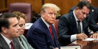 Image: Former President Donald Trump sits at the defense table with his defense team in a Manhattan court during his arraignment on April 4, 2023, in New York.