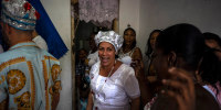 Maritza de la Rosa Perdomo, center, at a Santería ceremony in Havana on Nov. 13, 2022. 