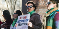 A woman protests in support of access to abortion medication on March 15, 2023 in Amarillo, Texas.