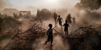 Children and women run through a cloud of dust in the village of El Gel, Ethiopia, on Jan. 12, 2023. The last five rainy seasons since the end of 2020 have failed, triggering the worst drought in four decades in Ethiopia, Somalia and Kenya. 