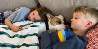 Kristen Kuhlman's kids are seen snuggling with their new pet dog, Strawberry.