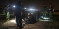 Migrants that were trying to evade U.S. Border Patrol agents, wait to be processed in Granjeno, Texas