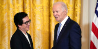 President Joe Biden shakes hands with actor Ke Huy Quan before a screening of the series "American Born Chinese" in the East Room of the White House in Washington. The screening was being held in celebration of Asian American, Native Hawaiian, and Pacific Islander Heritage Month, Monday, May 8, 2023. (AP Photo/Susan Walsh)