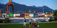 Image: A man drinks a beer at Crab Park in Vancouver, British Columbia on May 13, 2023.
