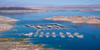 Boats docked along the shores of the Colorado River forming Lake Mead  April 15, 2023 in Boulder City, Nev.