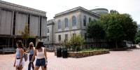 Students walk through the campus of the University of North Carolina in Chapel Hill in August 2020.