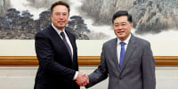 Elon Musk shakes hands with China's Foreign Minister Qin Gang in Beijing on May 30, 2023. 