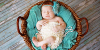 Newborn Baby Girl Sleeping in a Basket