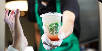 Starbucks workers give order at the drive-thru. Lemonade strawberry.