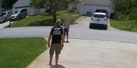 Terry Vetsch argues with a woman after her friend used his drive way to back up his car in Palm Coast, Fla.