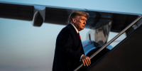 Former President Donald Trump boards his airplane, known as "Trump Force One," after speaking at a campaign event, at the Manchester-Boston Regional Airport on April 27, 2023, in Manchester, N.H.